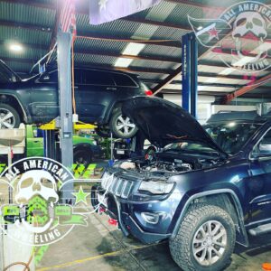 Jeep Grand Cherokee with bonnet lifted for servicing